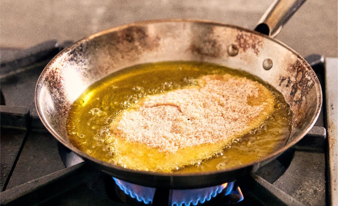 “Sizzle” being squeezed into a pan